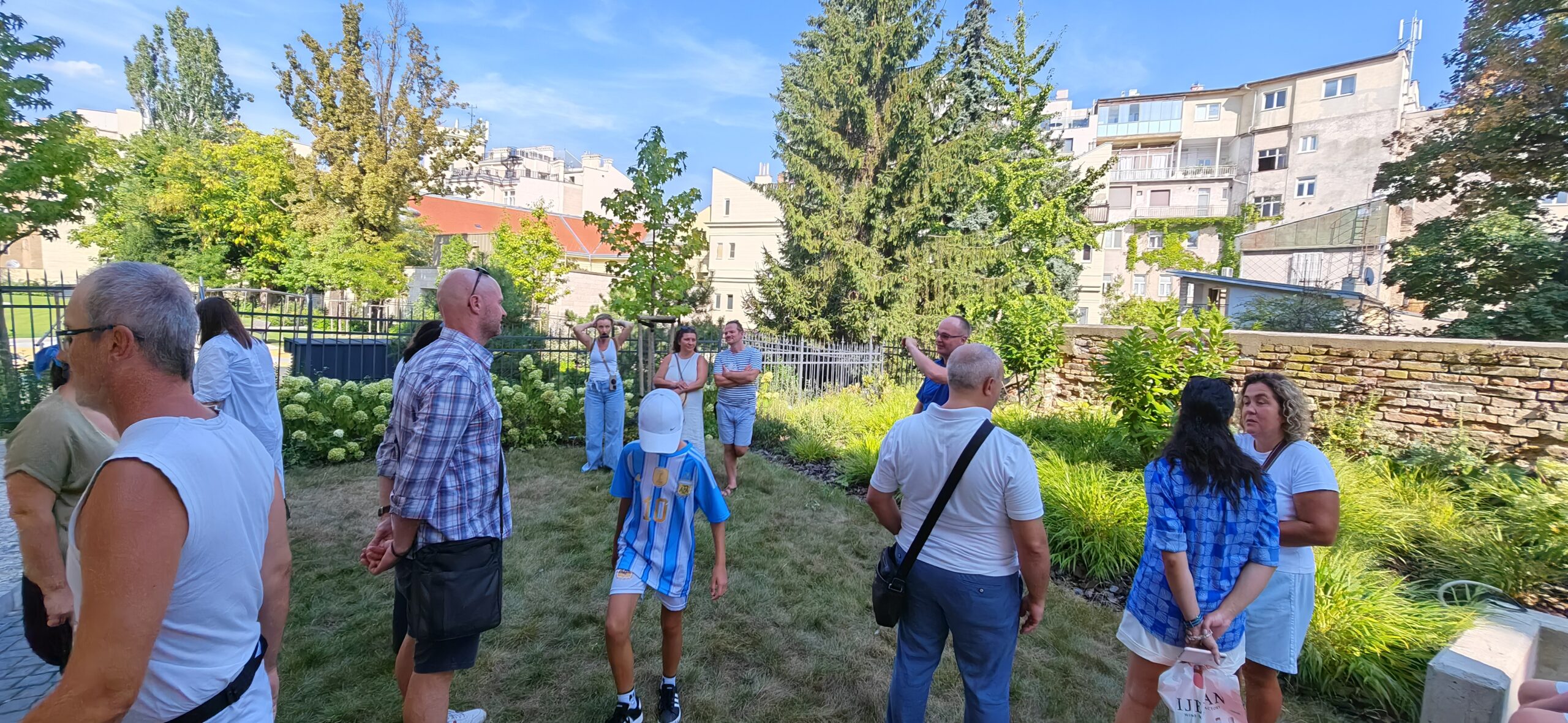 A small group of people talking together outdoors