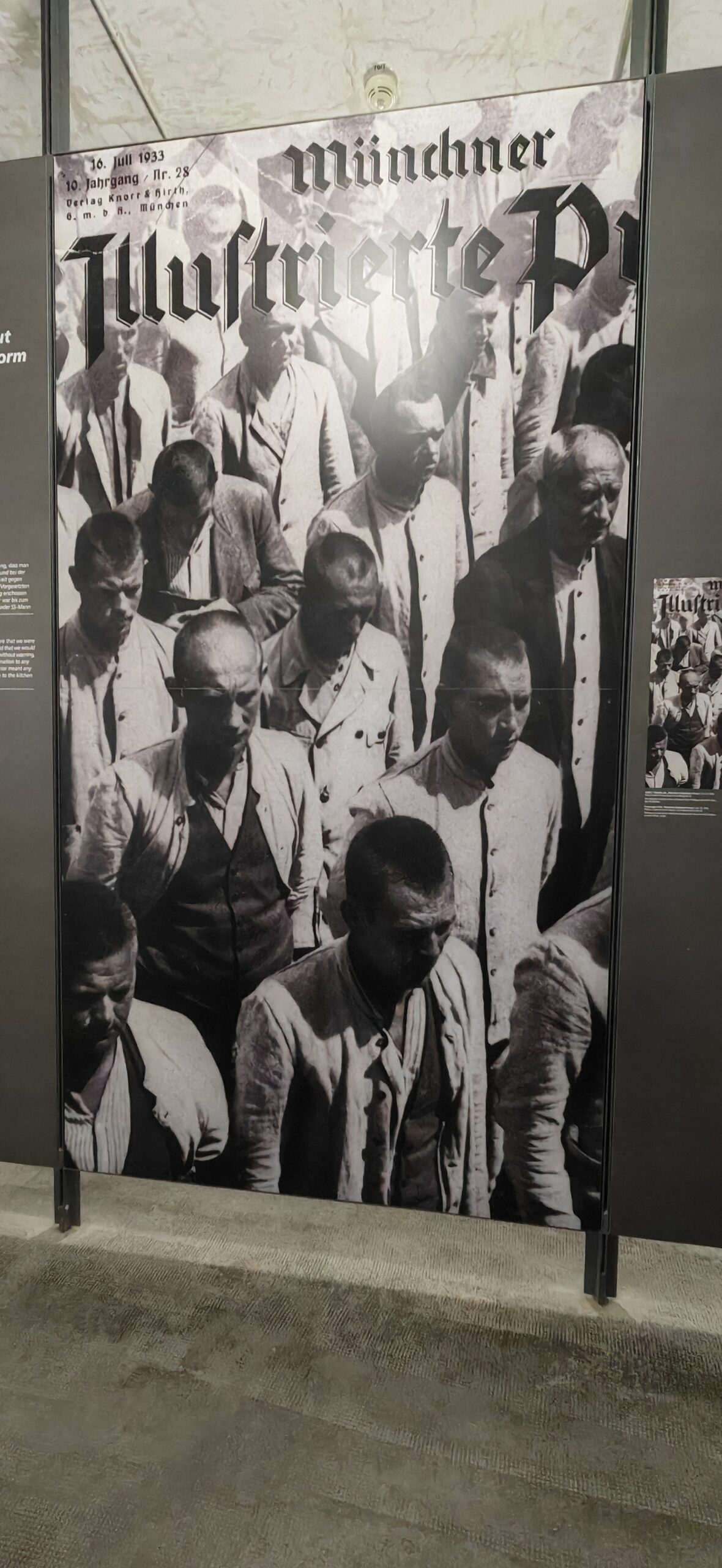 Archival newspaper photograph on display in a German history exhibition