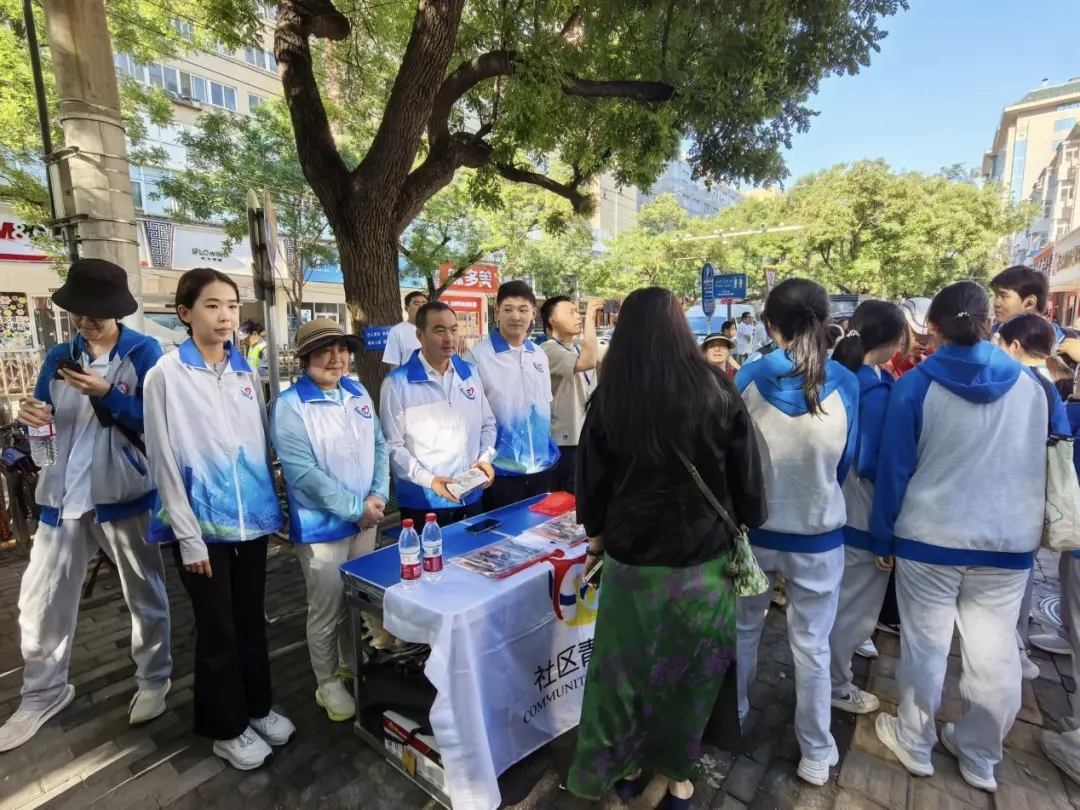 Volunteers gathered around an outdoor service table